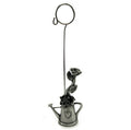 Picture holder with base made of pewter shaped as a watering can with roses inside ph2